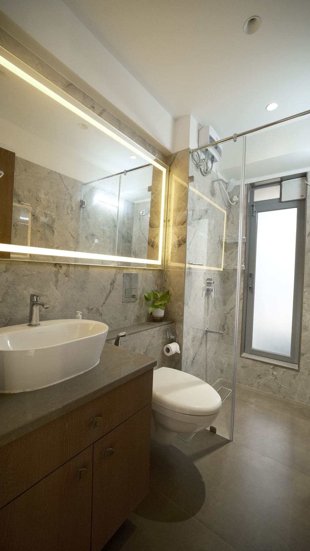 Bathroom vanity with backlit mirror, luxury bathroom design Mumbai
