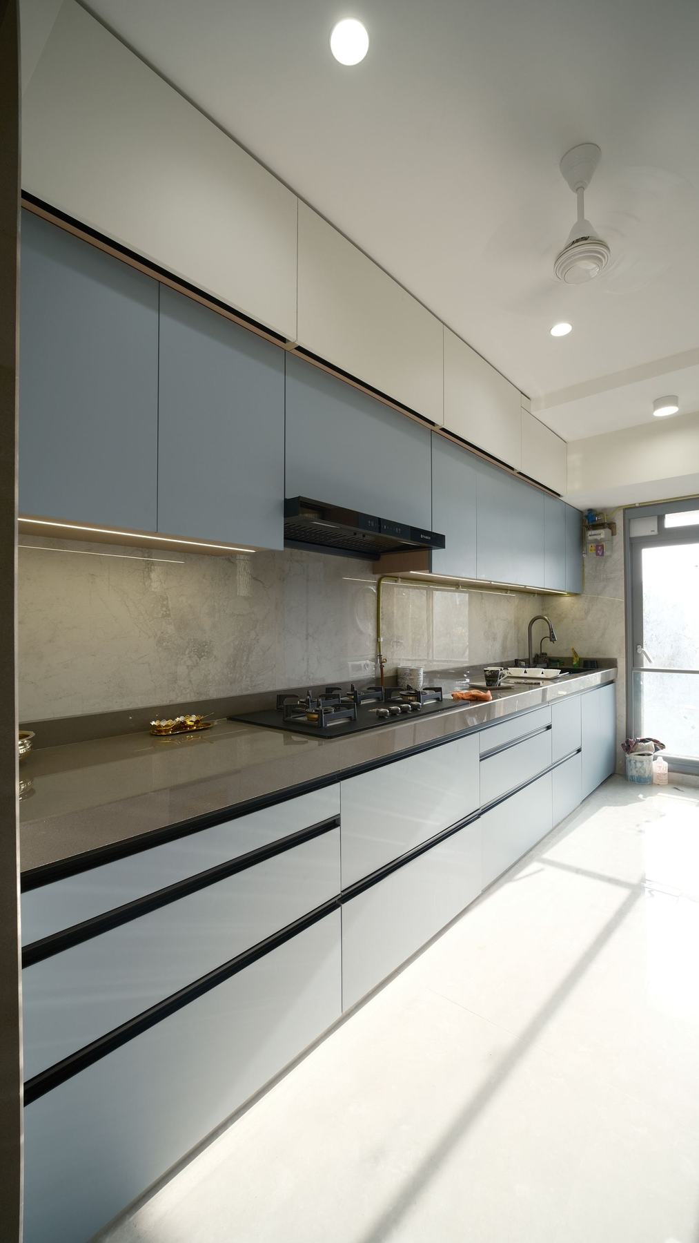Slate blue modular kitchen cabinets with quartz counter