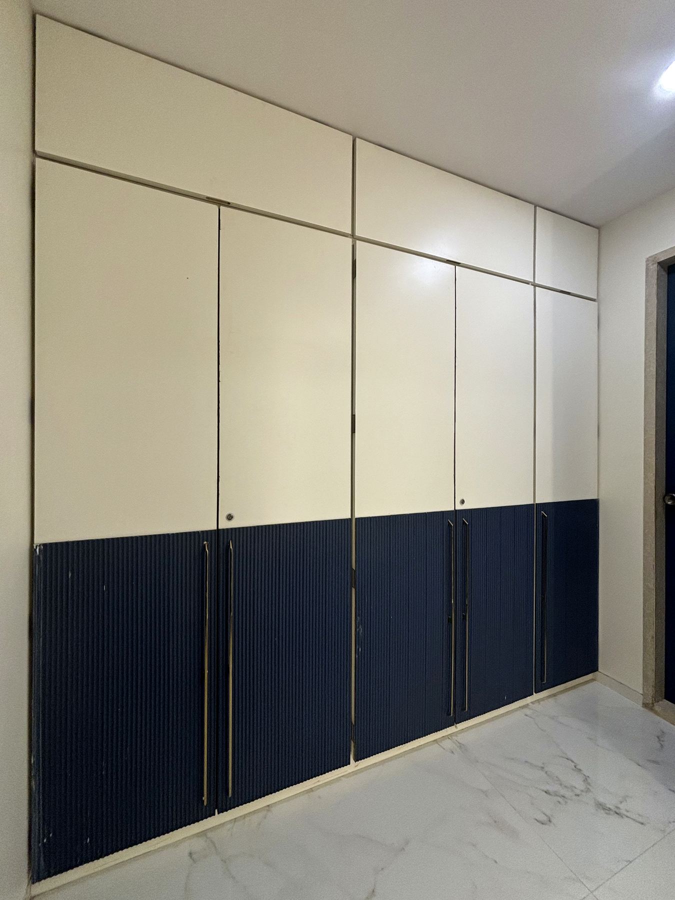 White and navy two-tone wardrobe shutters, Mumbai interiors